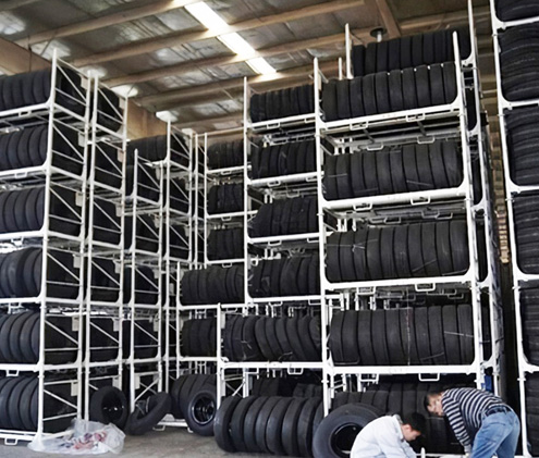 What are the benefits of using tire storage racks to store tires?